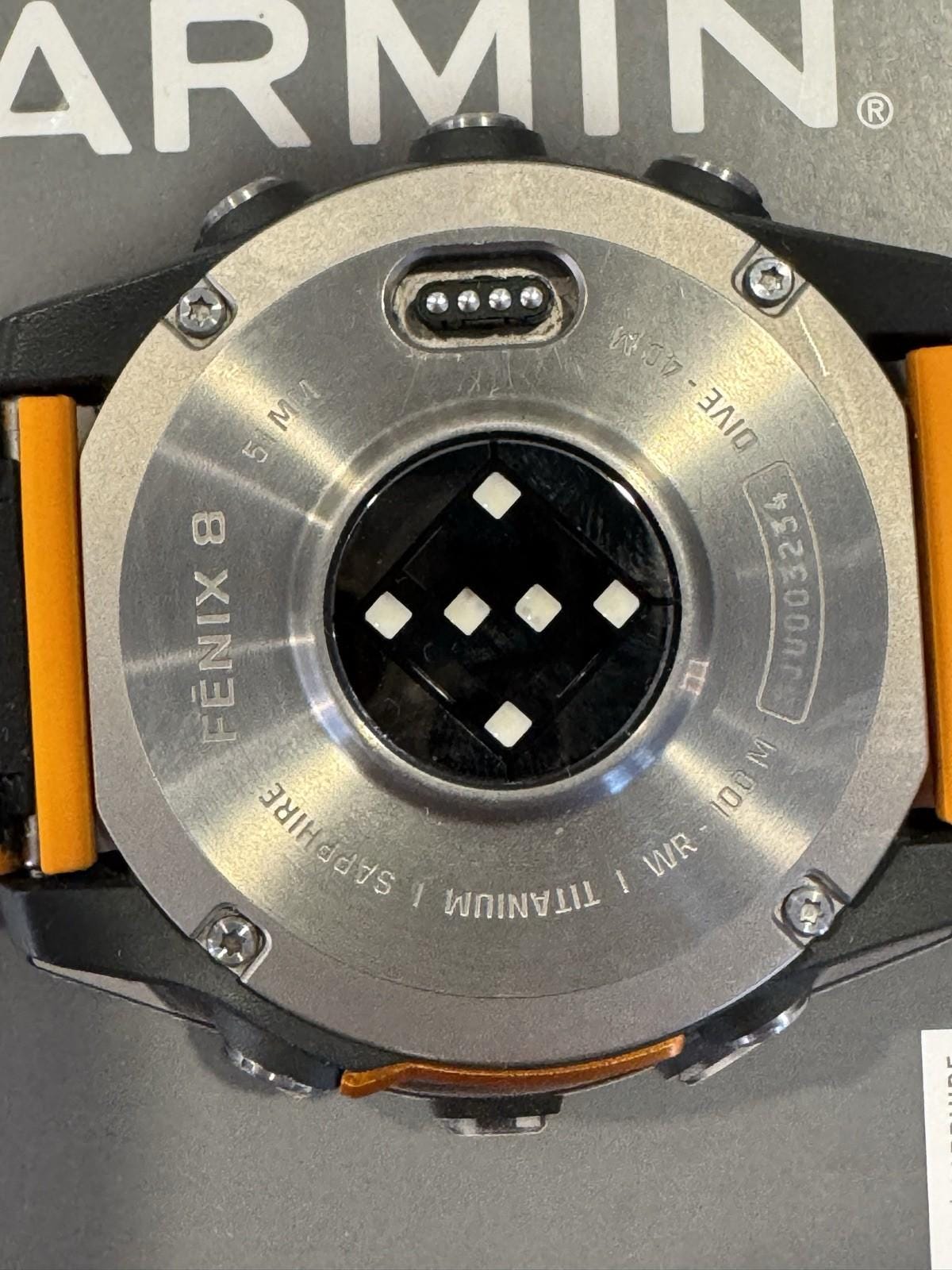 Garmin fenix 8 Amoled Sapphire 51 mm Watch Titanium w Spark Orange Silicone Band