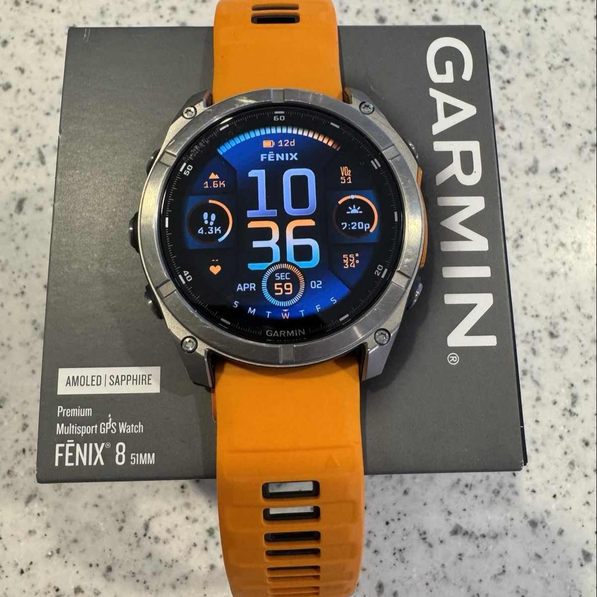 Garmin fenix 8 Amoled Sapphire 51 mm Watch Titanium w Spark Orange Silicone Band