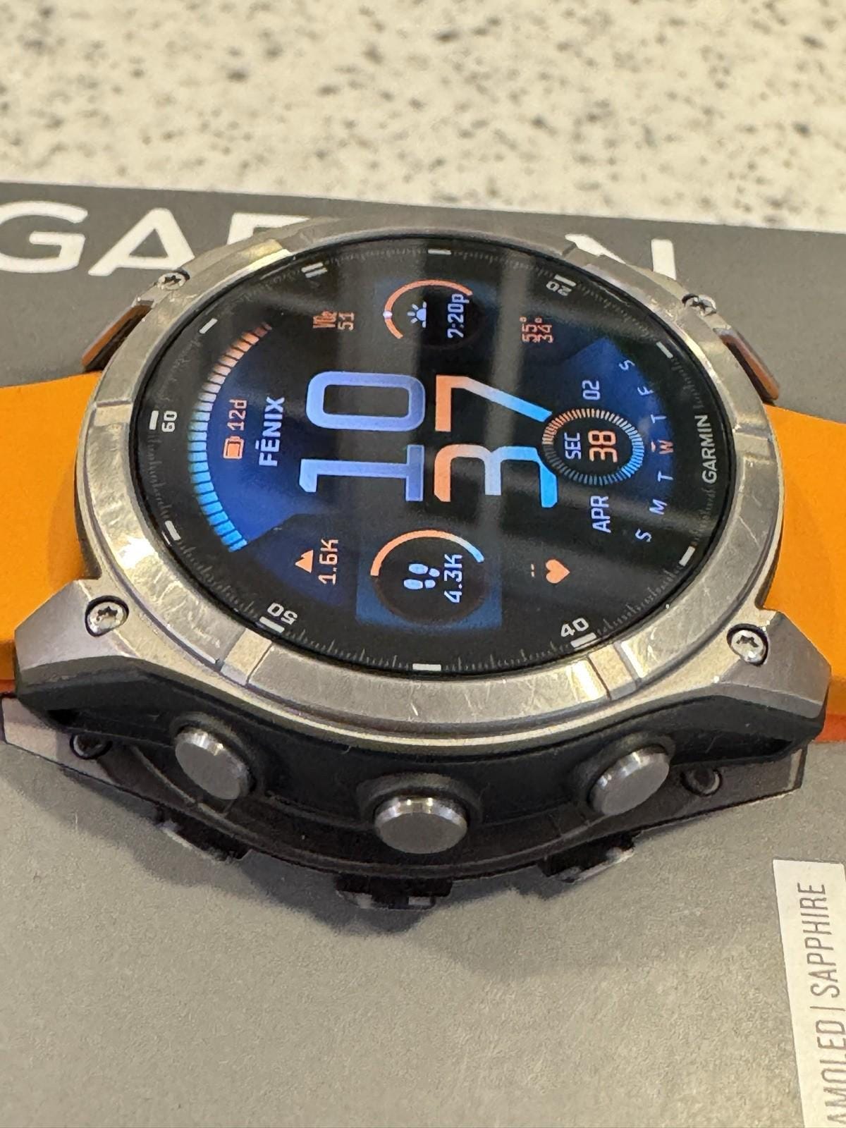 Garmin fenix 8 Amoled Sapphire 51 mm Watch Titanium w Spark Orange Silicone Band
